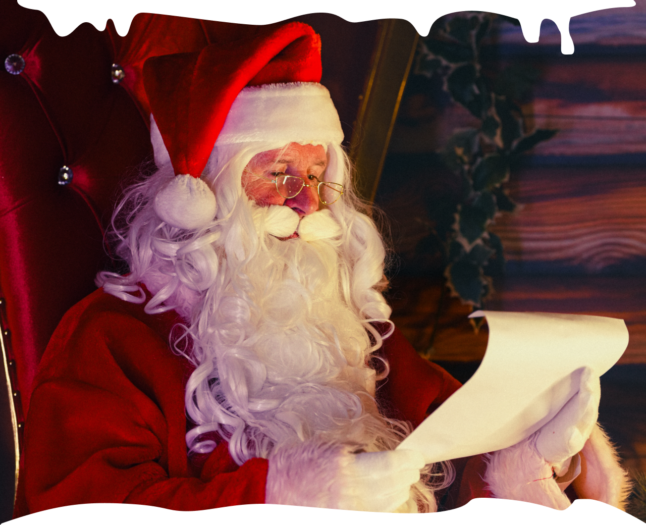 Father Christmas reading a letter from a child.